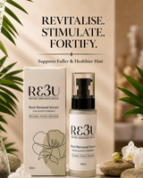 RE3U Root Renewal Serum shown with its white and beige packaging box and pump bottle, styled with decorative green leaves, white flowers, and stones on a warm beige background. Text above reads 'REVITALISE. thumbnail 1